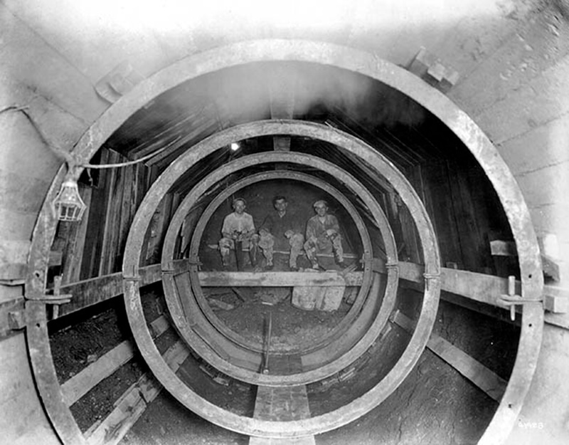 workers eating lunch while building a sewer