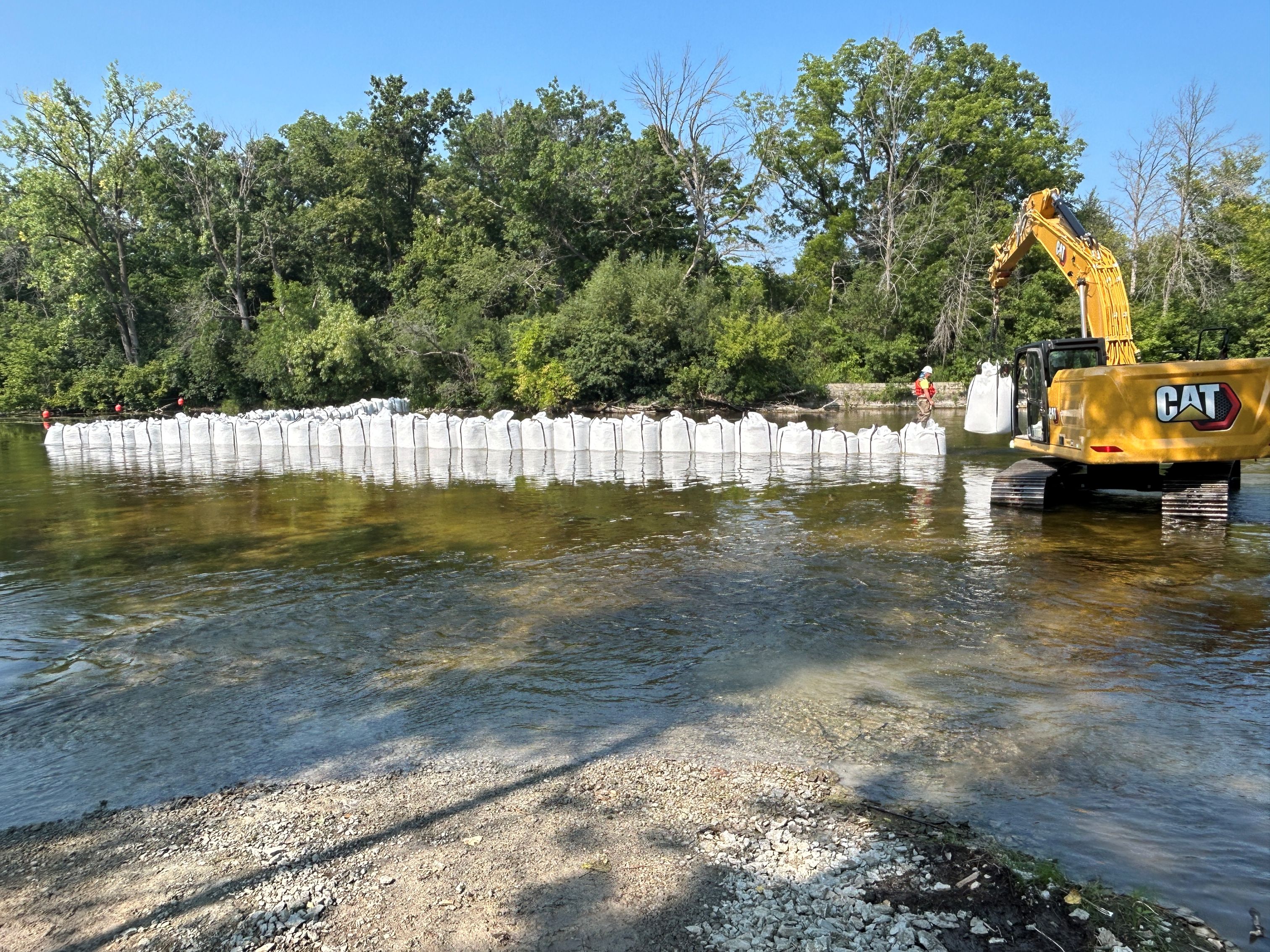 Construction contractor isolated the work area using large bags filled with sand and rock, sending all the river water to the western half