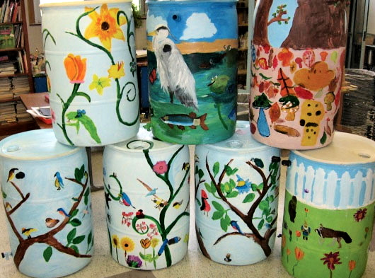 stack of painted rain barrels