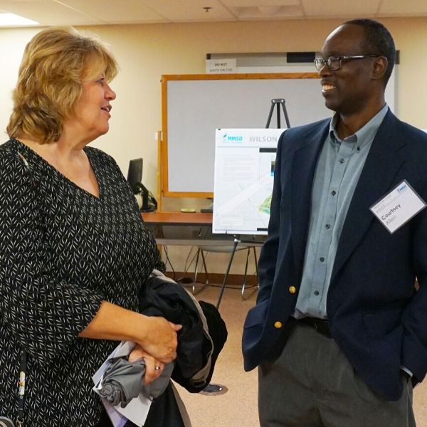 courntey allen project engineer talking to a resident