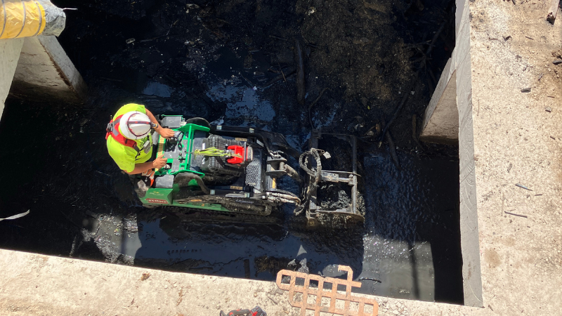 construction crew cleaning blockage in sewer