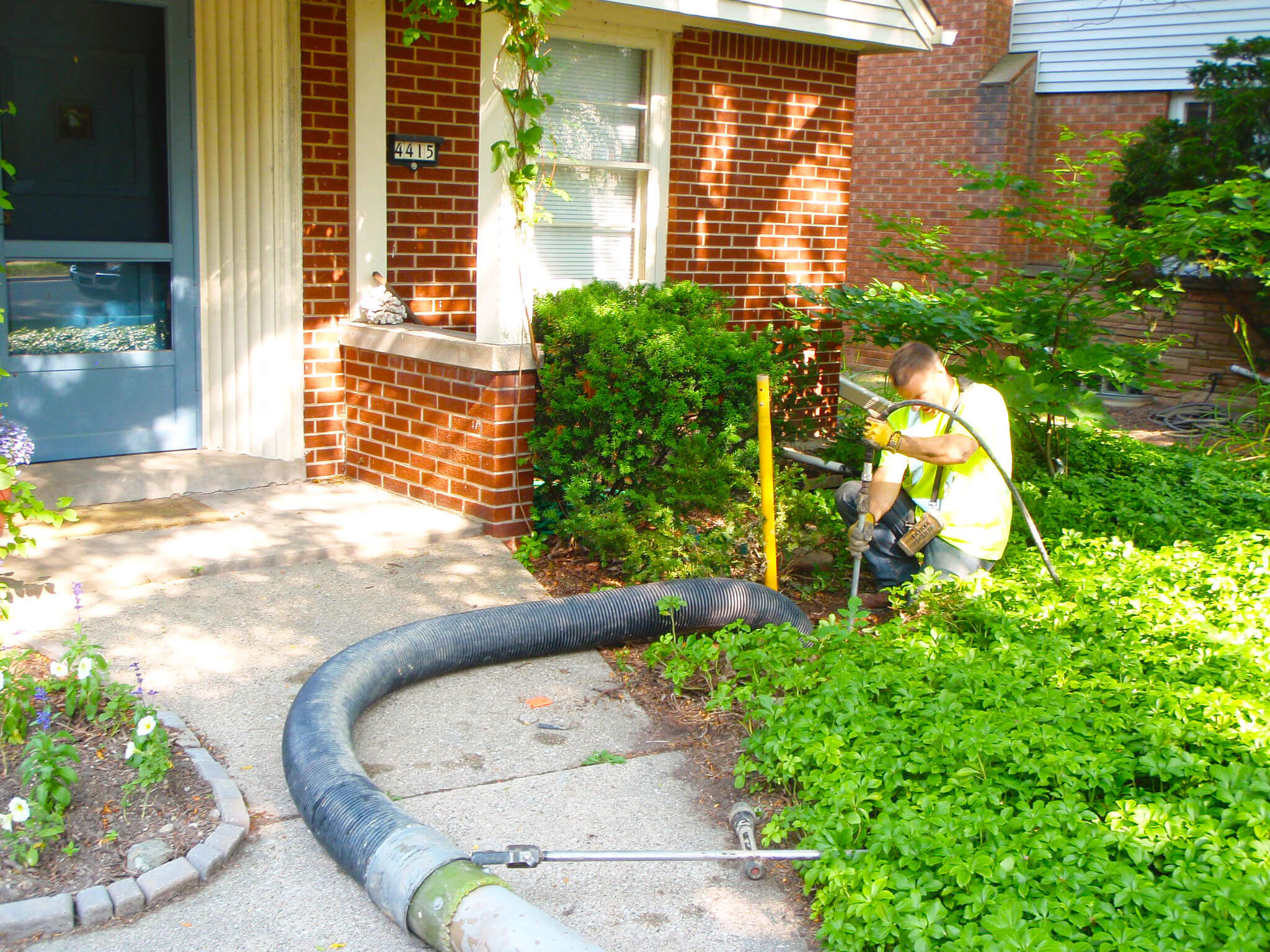 man working on a Shorewood home's lateral sewer pipe