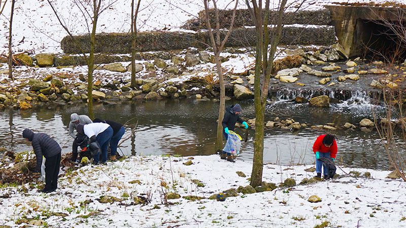 Cleaning debris out of river for Adopt a River