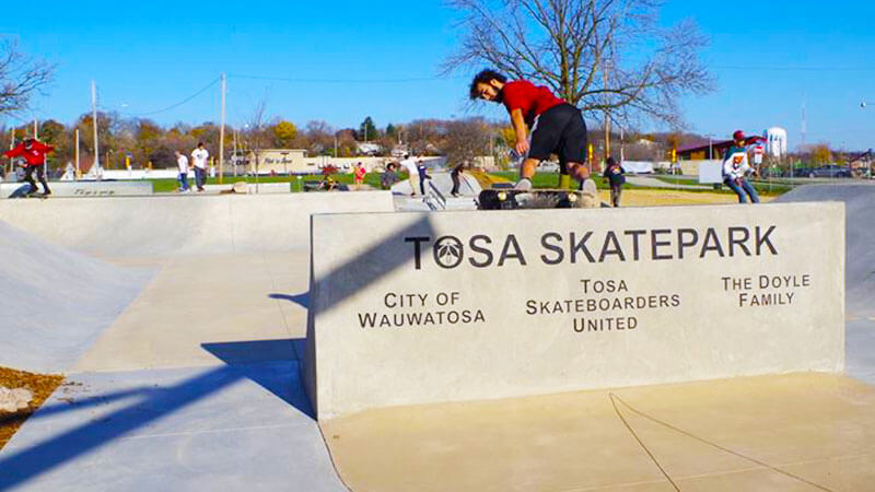 Chile skateboarding near Tosa skatepark sign