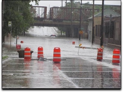 street flooded under bridge