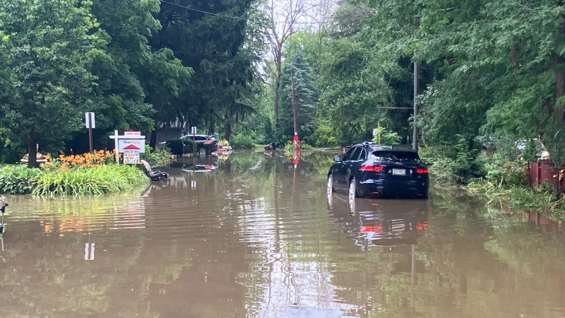flooded road in glendale WI milwaukee river
