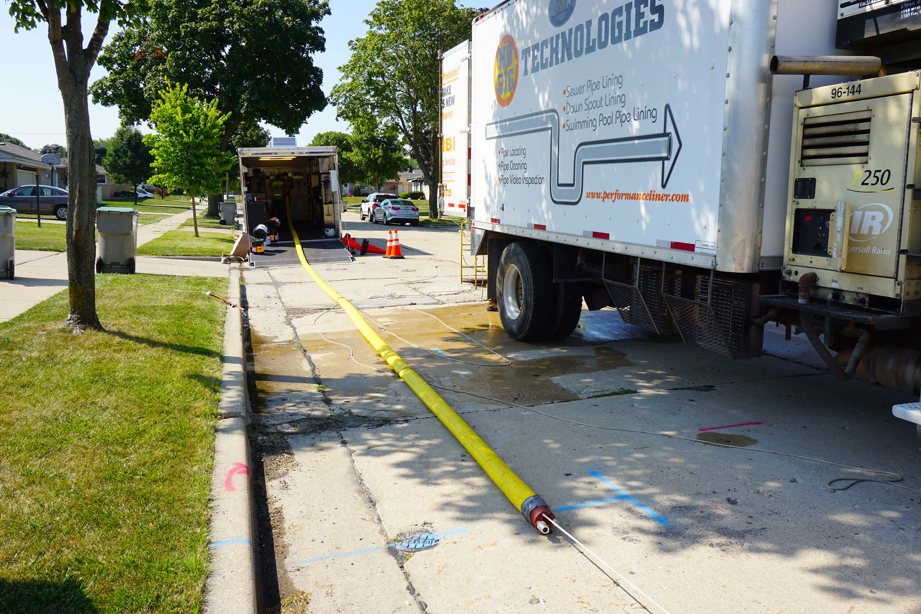 sewer pipe cleaning hose laying in the street